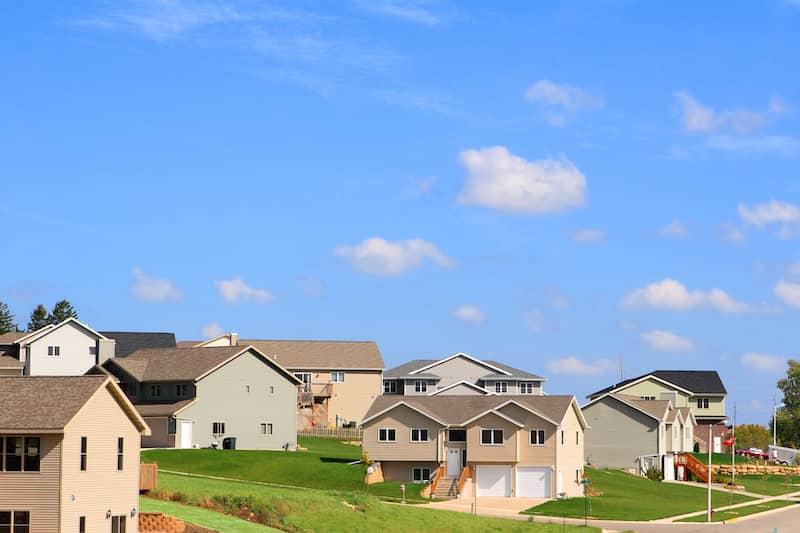 Neighborhood of split level homes built into hills