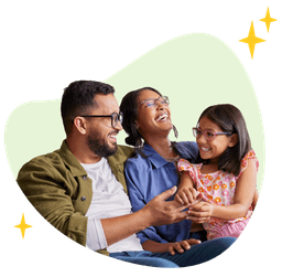 Family hugging, smiling and laughing