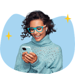 A smiling woman is checking her phone