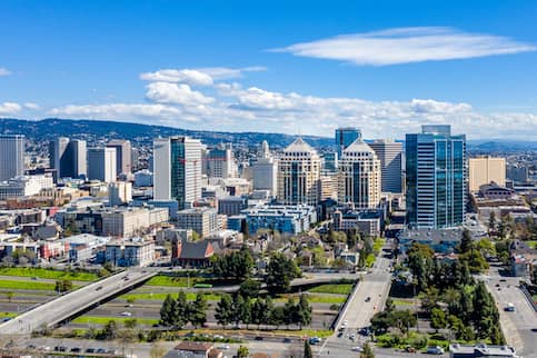 Downtown Oakland skyline with blue sky.