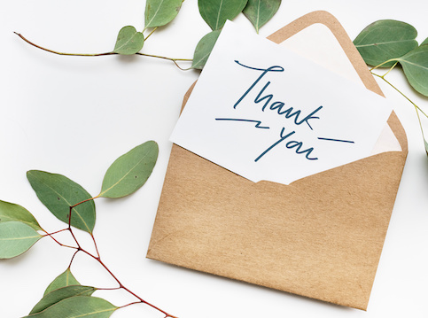 Thank you card pulled out of envelope.