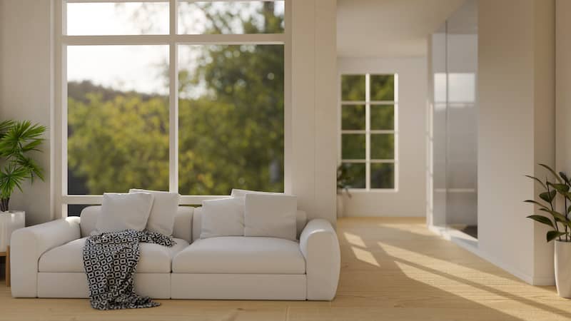 Living room with neutral walls and big picture window.