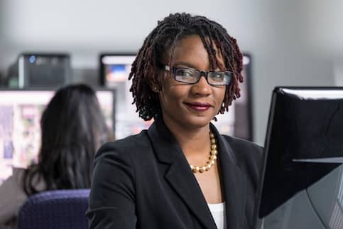 African-American businesswoman on computer.