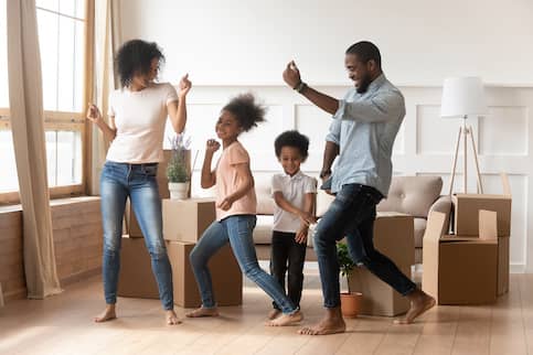 African-American family celebrates purchase of new home.