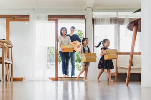 Asian-American family moving into new home.