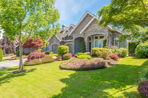 Large house with front yard garden.