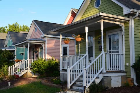 Line of three colorful cottages in Raleigh, North Carolina.