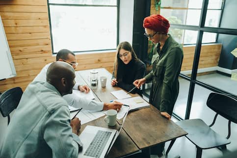 Group of business people in a meeting in a conference room.