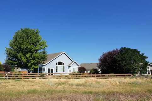 Large country home in field.