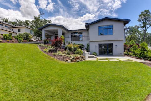 Modern house with big front lawn.