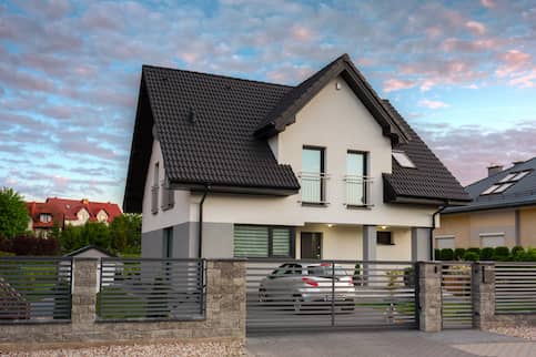 A modern single family house at sunset.