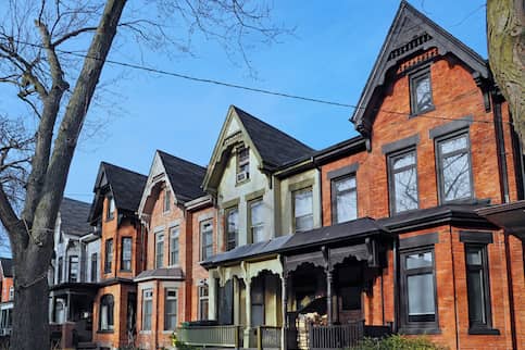 Row of brick Victorian homes.