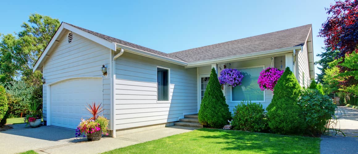 Small house with hanging flowers.