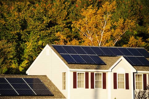 Solar panels on house during fall.