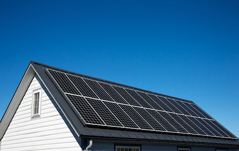 Solar panels on roof of small home.