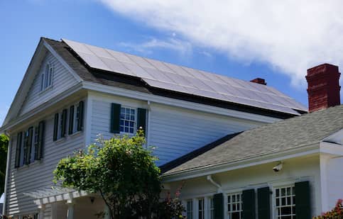 Solar Panels On The Roof Of A Traditional Colonial Style House