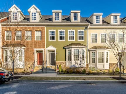 Townhouses in a row in different colors.