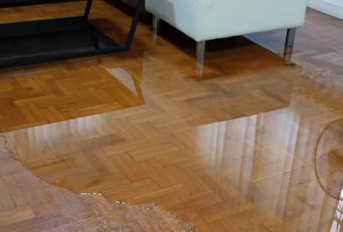 Water Spreading On Wooden Floor