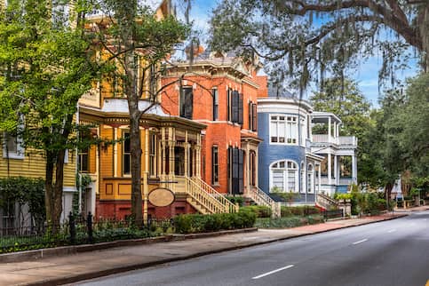 Brightly colored homes along Whitaker street in Savannah, Georgia.