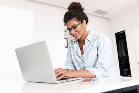 Young Woman Working On A Laptop Computer