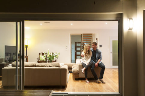 Couple Sitting on Couch In Living Room