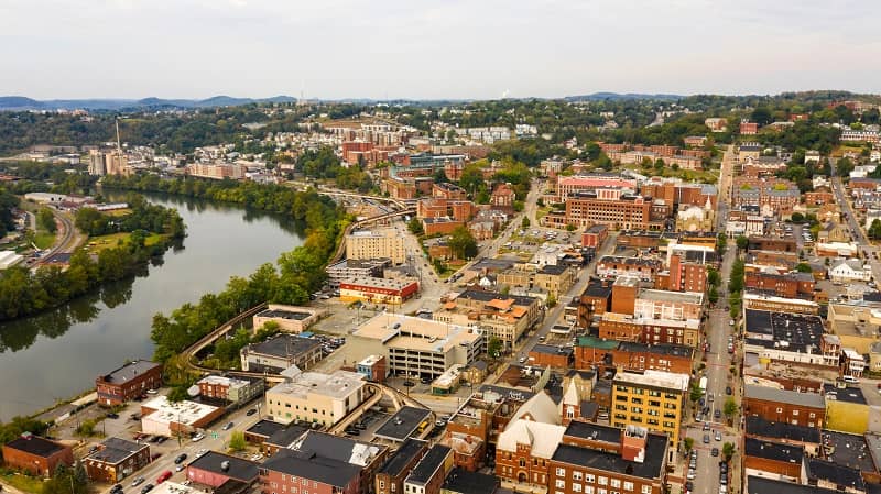Aerial view of Morgantown, with buildings and river bend.
