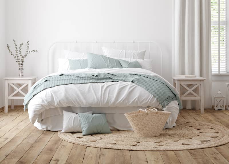 Bedroom in modern farmhouse with natural colors and soft lighting.