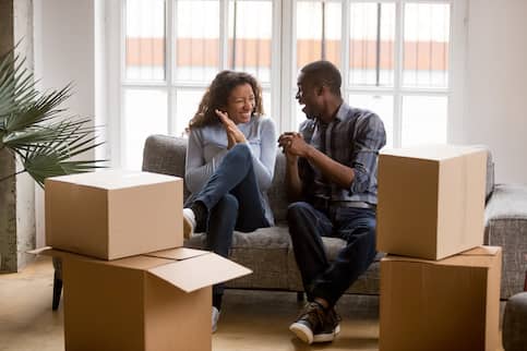 African-American couple moving into new home together.