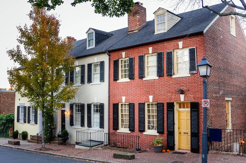 Traditional brick two story row houses in Alexandria Old Town, Virginia.