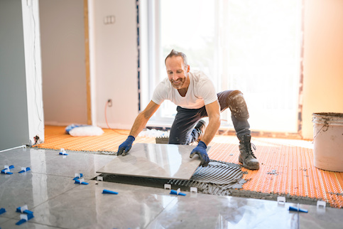 Contractor installing new flooring.