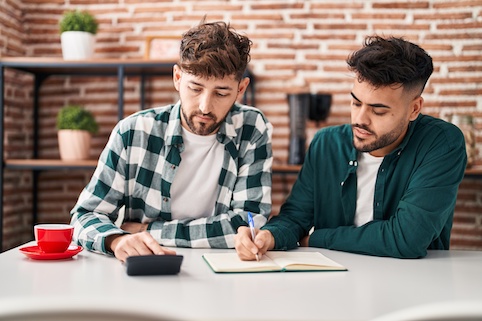 Young couple working on their finances together.