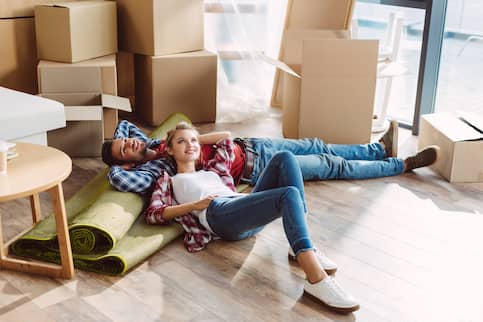 Couple resting in new house.