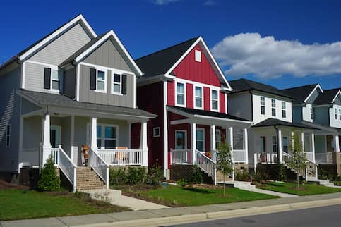 A row of red and gray row houses.