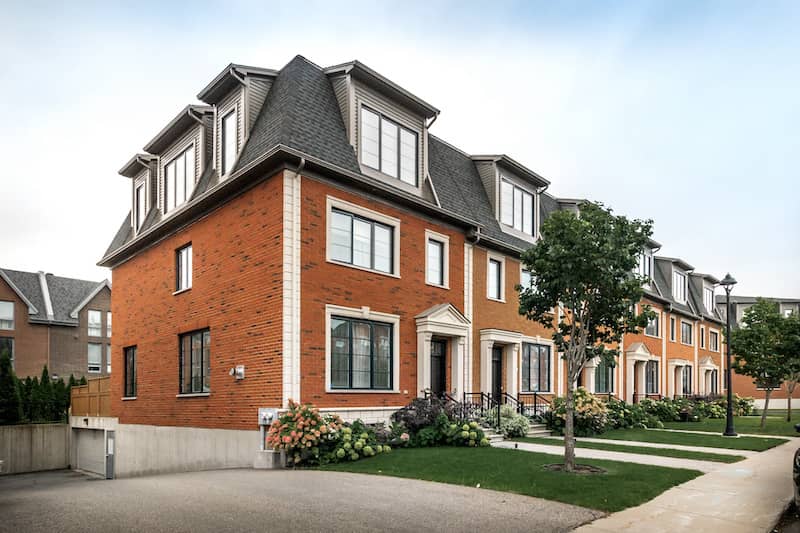 Brick building with several townhouses.