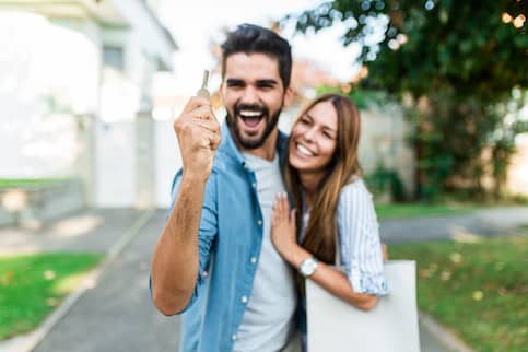 Couple excited after purchase agreement and house offer goes through.