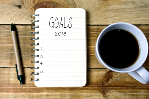 mortgage goals notebook on wood desk