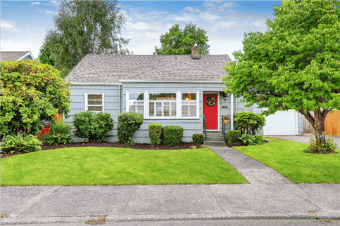 Small blue house in neighborhood.