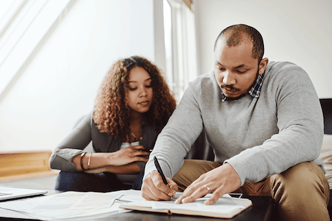 Couple reviewing real estate terms 