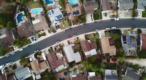 Aerial shot of houses in a neighborhood.