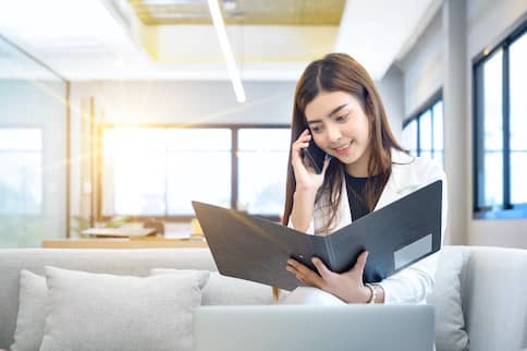 Woman Looking At Folder 