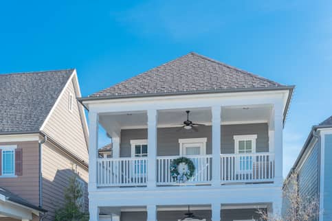 grey beach house with wreath