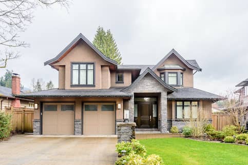 Brown terracotta home with stone entryway.