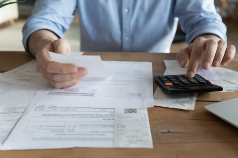 Man calculating finances and budget.