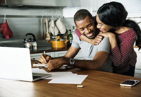 couple hugging in kitchen