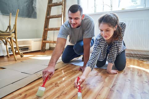 Couple Staining New Wood Floor