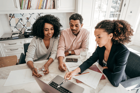 Couple sitting with real estate agent.