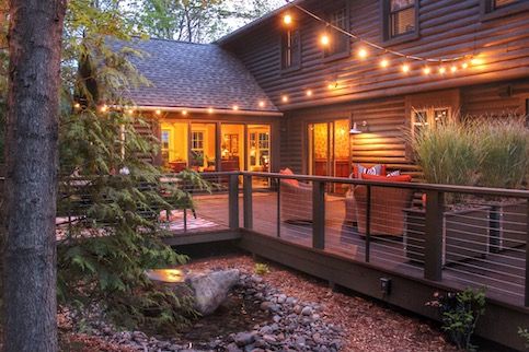 Cozy outdoor living space with string lights. 