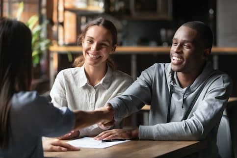 couple shaking hand with woman