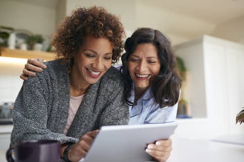 Female couple on tablet