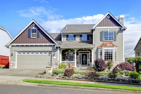 Green House With Brown Siding